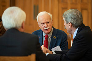 Three people talking to each other Three people talking to each other