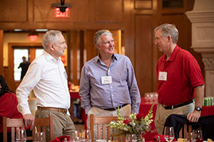 Three men talking Three men talking